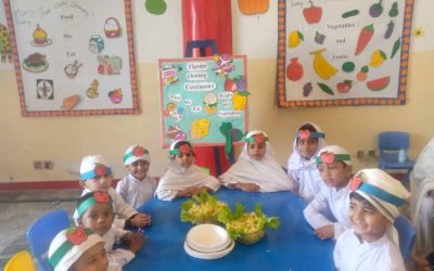 Children at the theme closing ceremony with educational posters in background.